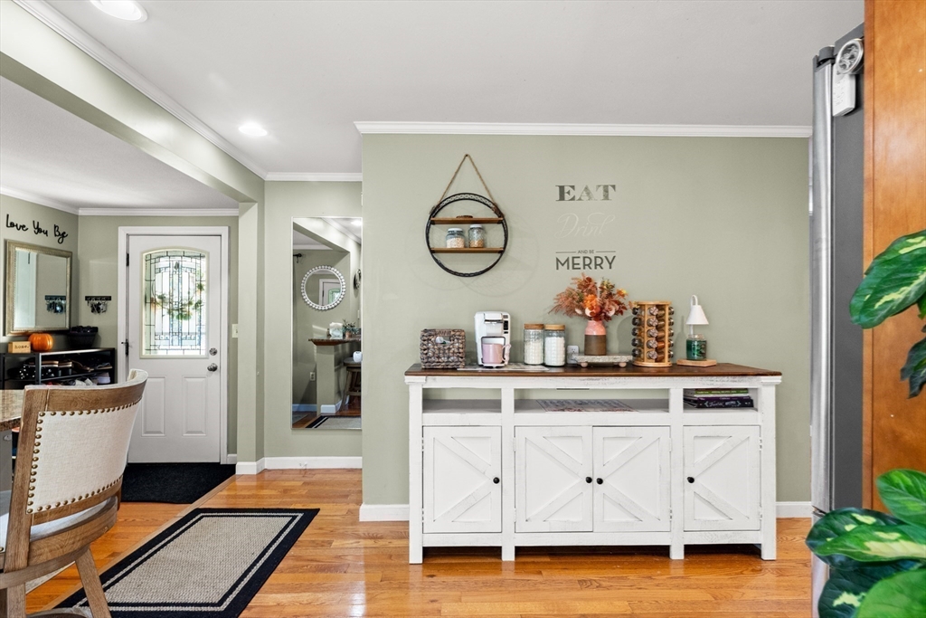 35 Memorial Drive Methuen, MA 01844 - Photo 8 of 42 a view of cabinets a wooden floor and a chandelier