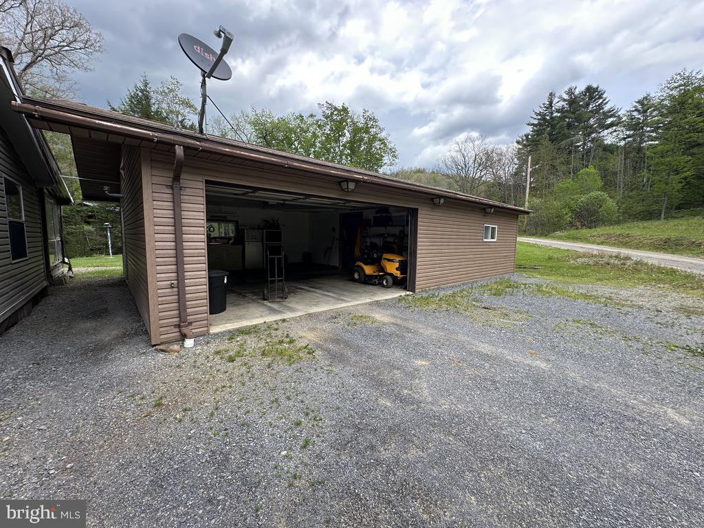 111 Rob Roy Road Bradford, PA 16701 - Photo 8 of 41 Spacious garage with scenic backdrop.