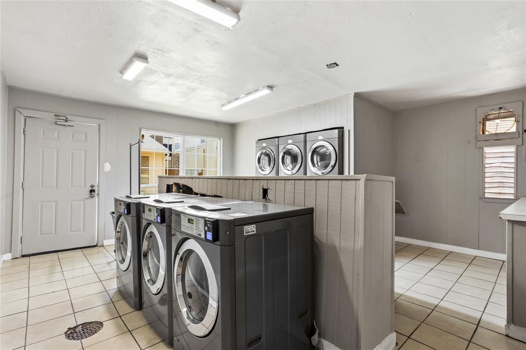 5540 Boca Raton Boulevard, Unit 181 Fort Worth, TX 76112 - Photo 19 of 21 Dedicated On-Site laundry room featuring multiple front-loading washing machines and dryers
