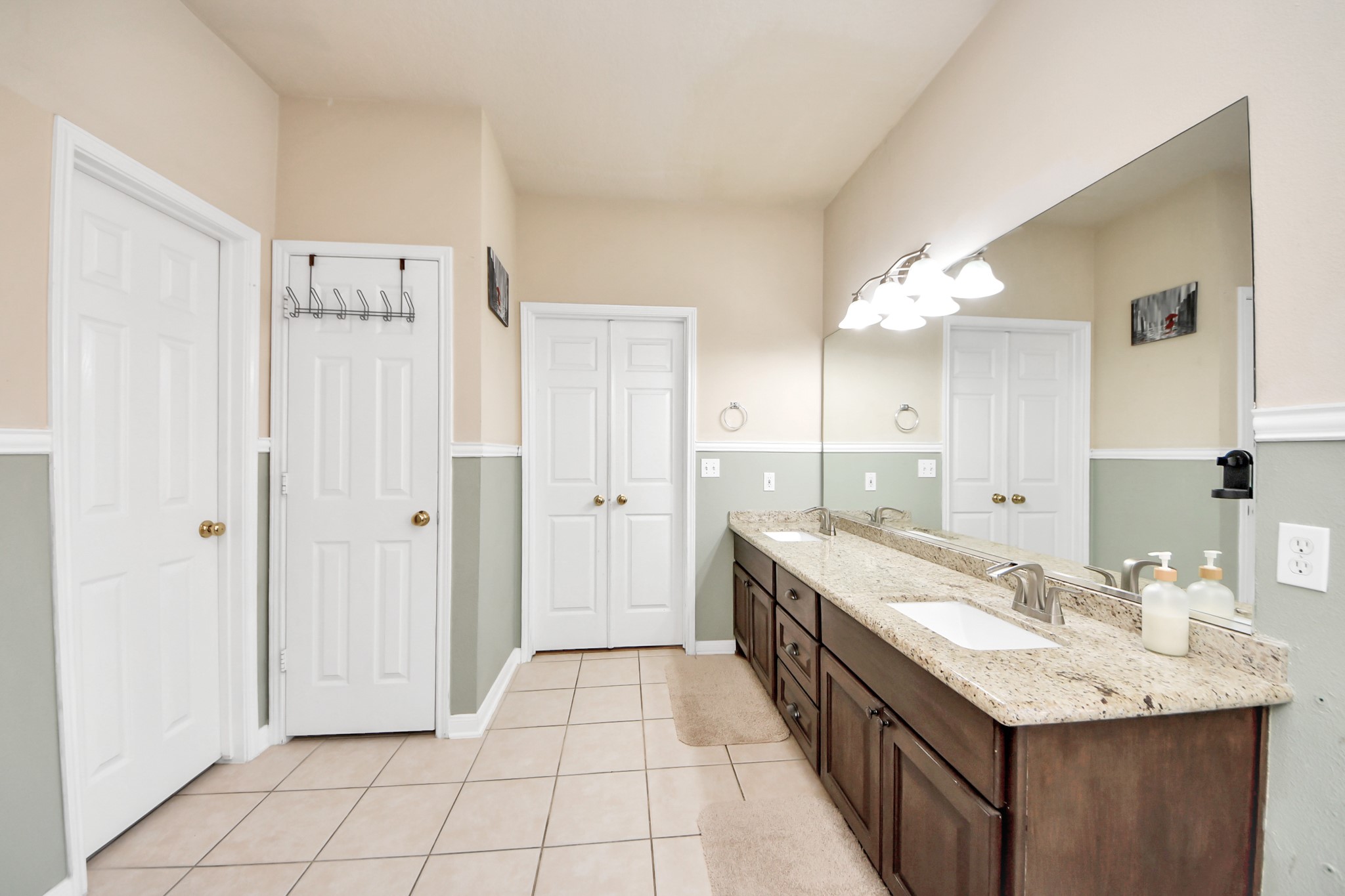 13635 Treebank Lane Houston, TX 77070 - Photo 11 of 26 a bathroom with a granite countertop sink a mirror and a shower