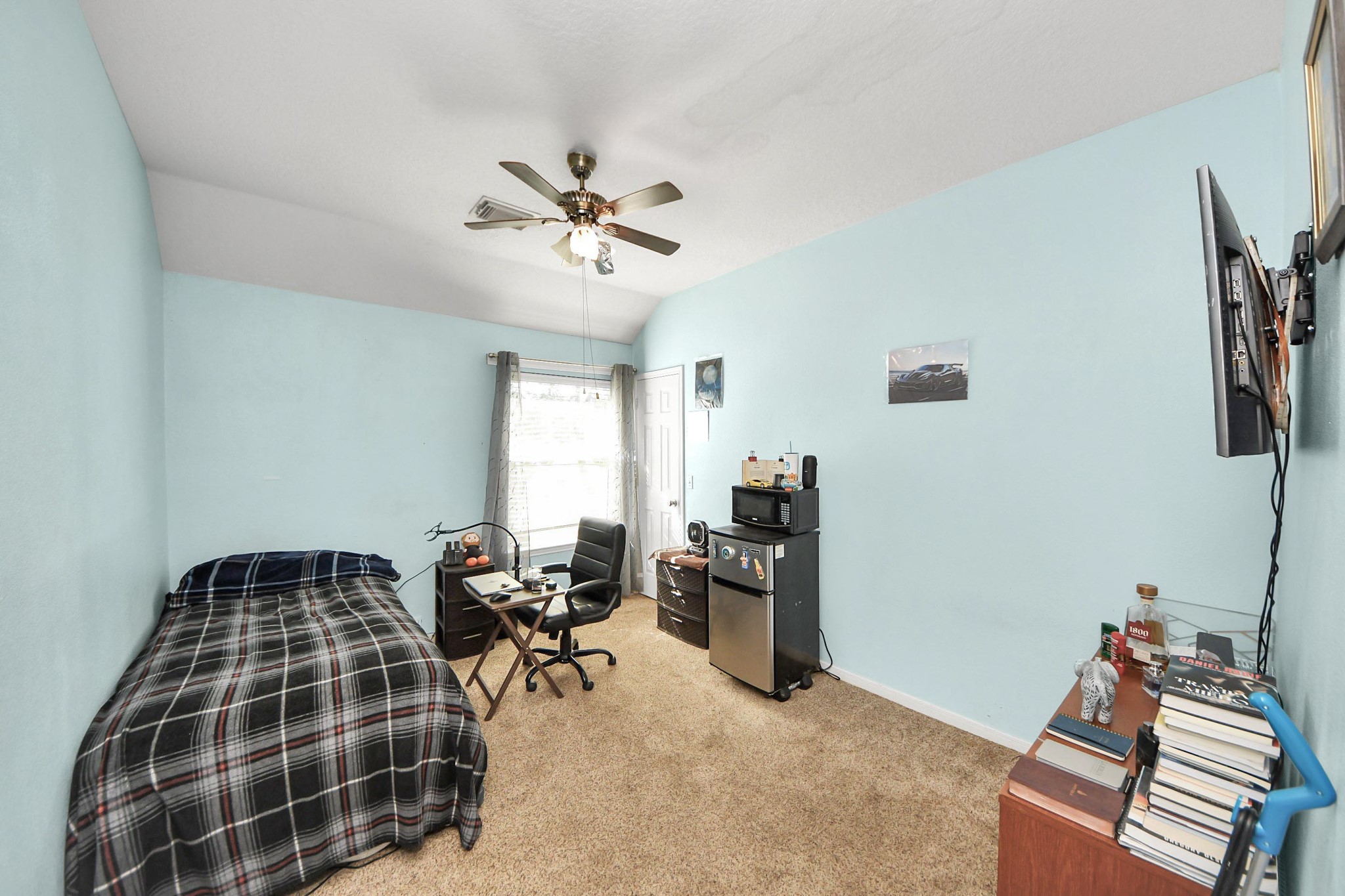 13635 Treebank Lane Houston, TX 77070 - Photo 16 of 26 a bedroom with furniture and a window