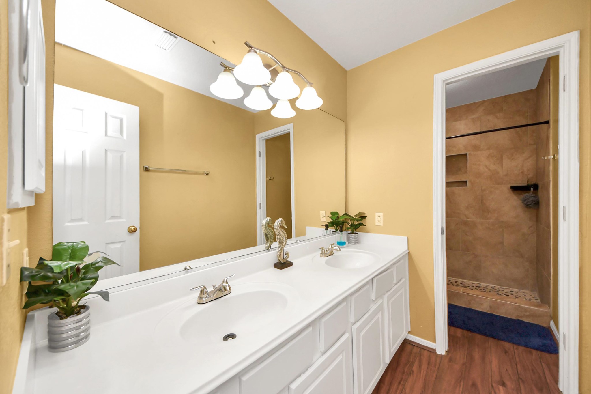 13635 Treebank Lane Houston, TX 77070 - Photo 17 of 26 a bathroom with a double vanity sink and a mirror