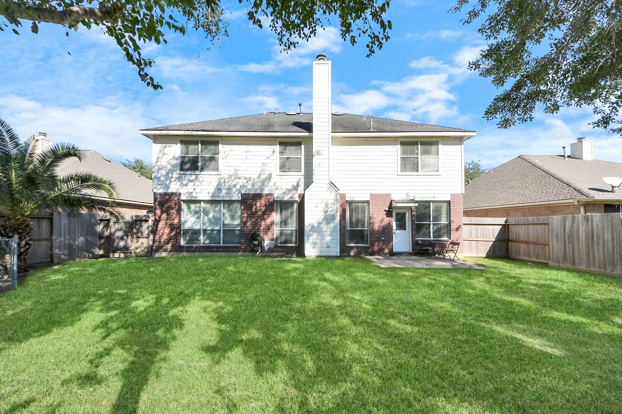 13635 Treebank Lane Houston, TX 77070 - Photo 20 of 26 a view of a house with a yard and sitting area