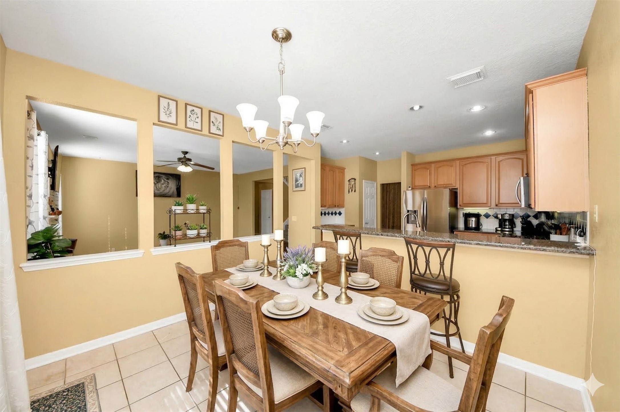 13635 Treebank Lane Houston, TX 77070 - Photo 8 of 26 a view of a dining room with furniture and a chandelier