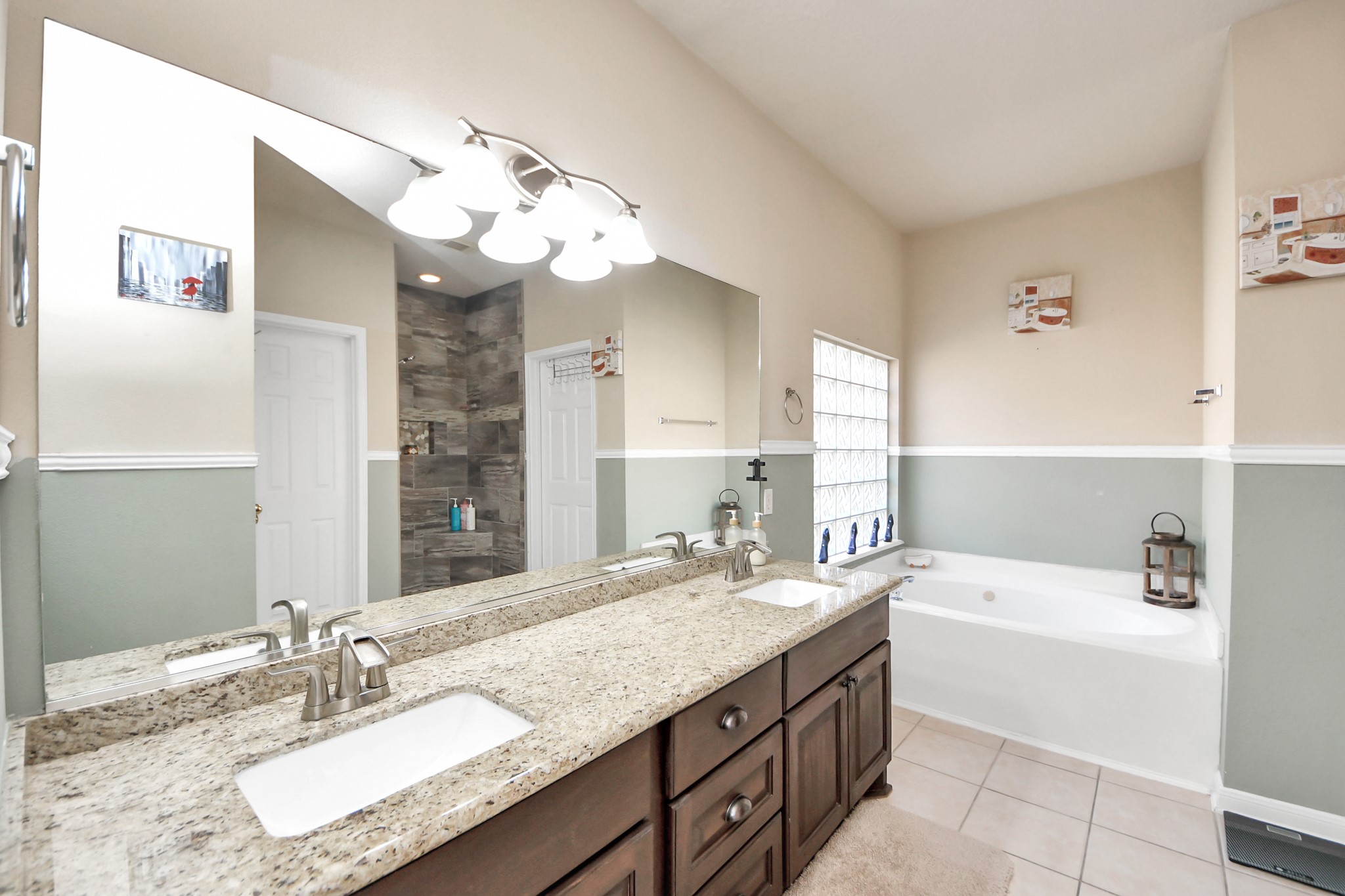 13635 Treebank Lane Houston, TX 77070 - Photo 10 of 26 a bathroom with a granite countertop double vanity sink and a mirror