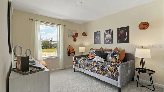 a bed room with a bed and a lamp