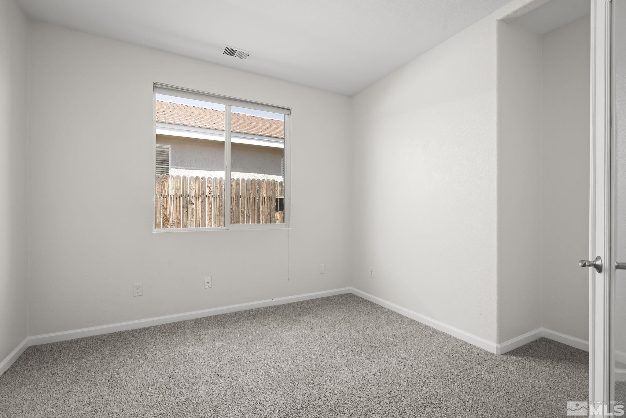 10414 Rockport Lane Reno, NV 89521 - Photo 17 of 22 an empty room with a window