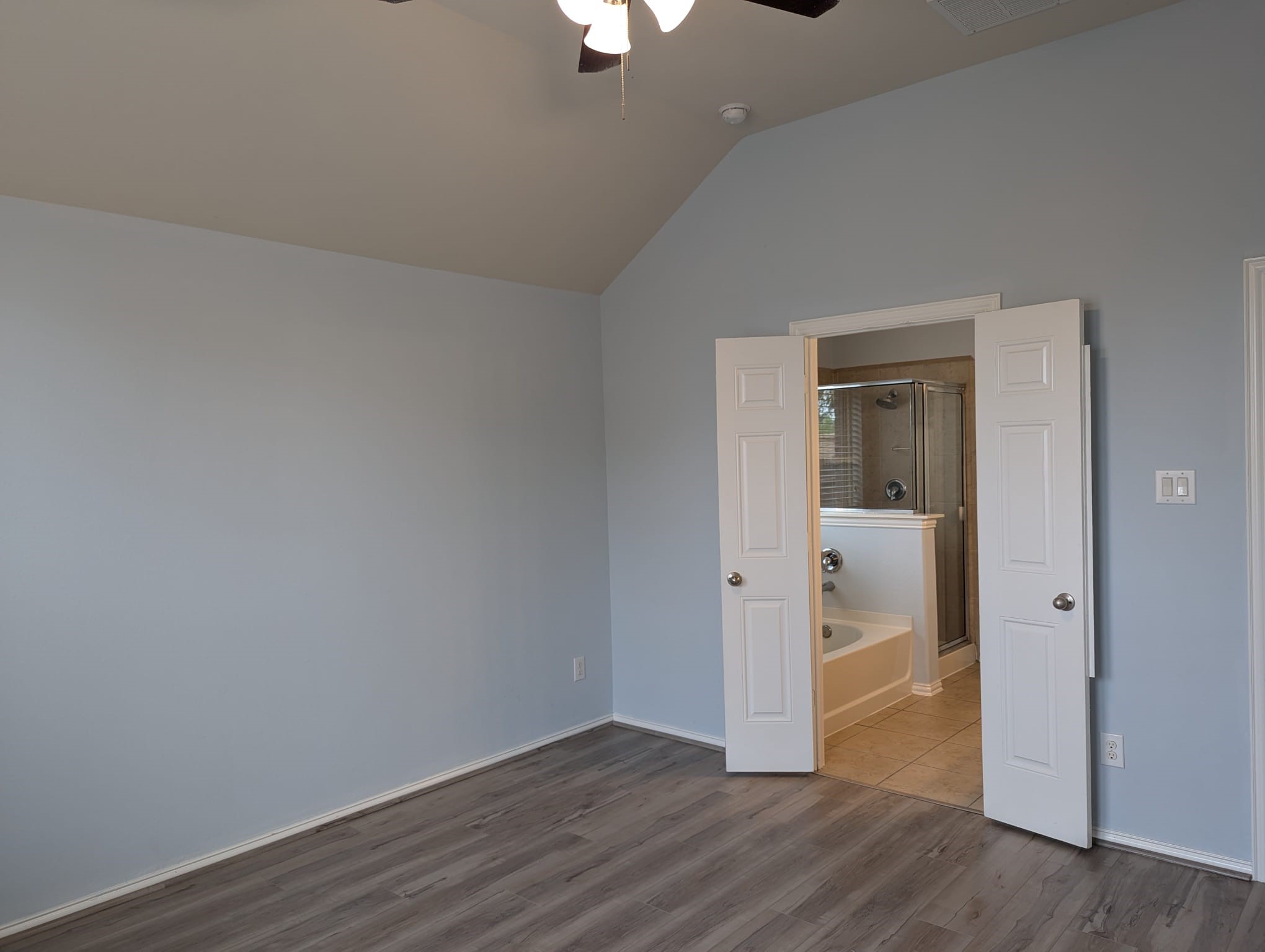 8041 Silent Deep Drive Rosenberg, TX 77469 - Photo 13 of 24 Spacious Master Suite with Modern Flooring and Attached Ensuite Bath