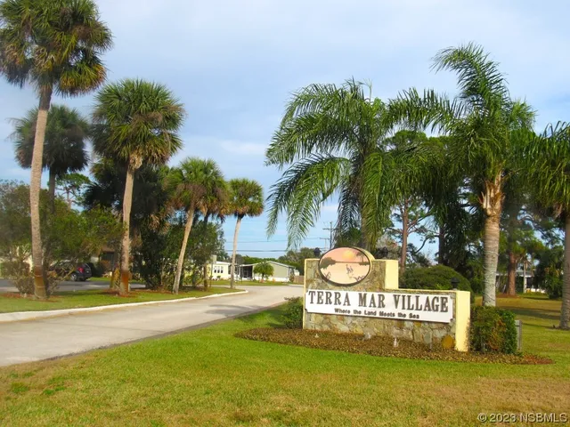 a view of outdoor space with sign board and garden