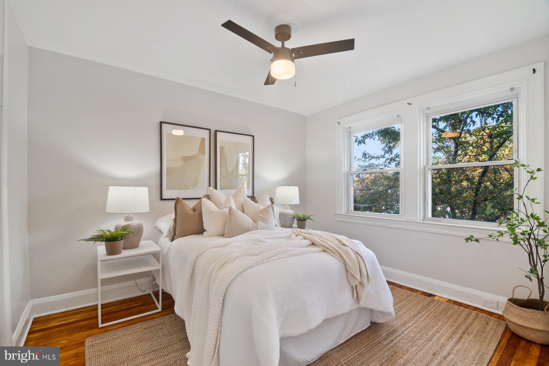 101 Willow Spring Road Dundalk, MD 21222 - Photo 13 of 28 a bedroom with a bed a window and painting on the wall