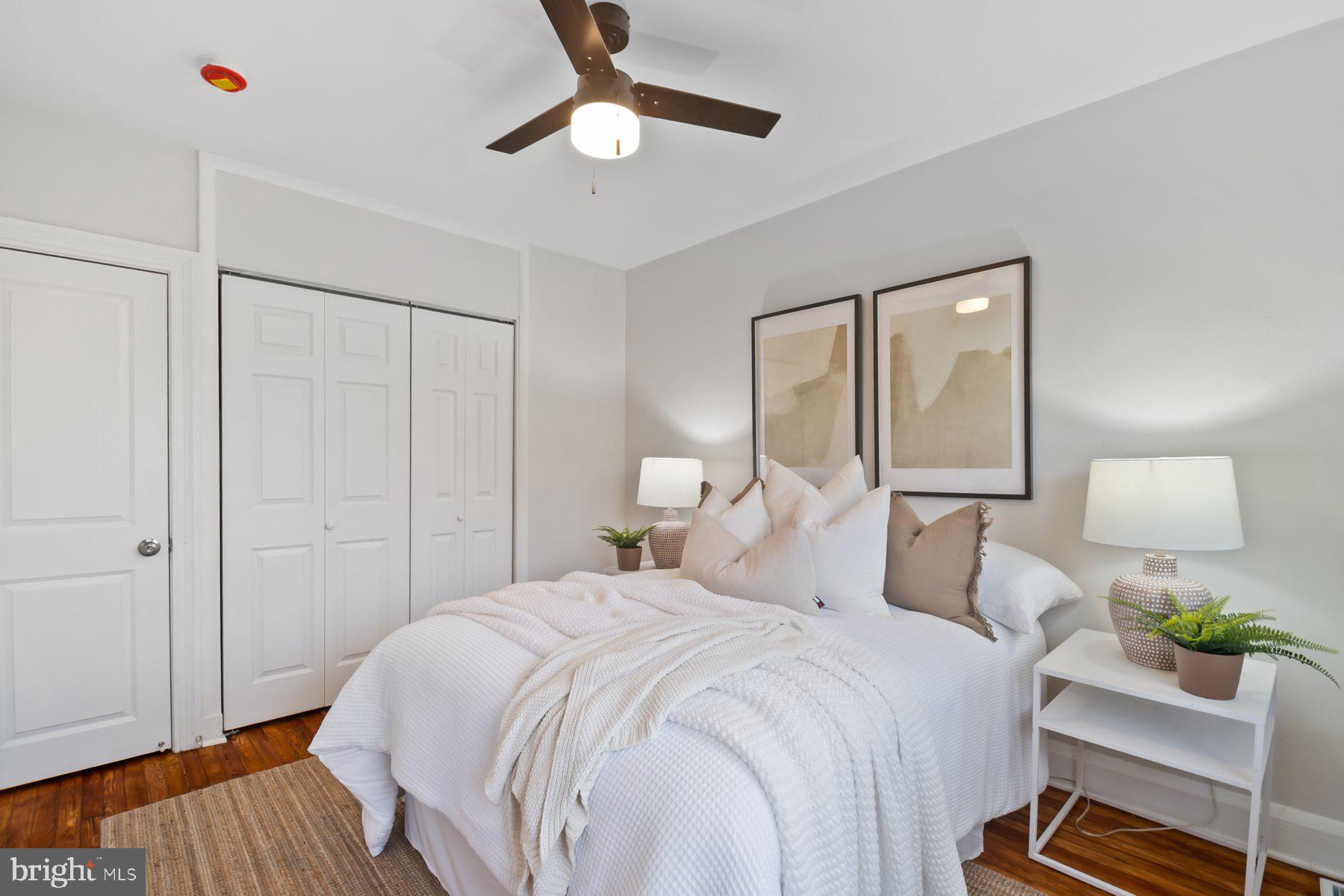 101 Willow Spring Road Dundalk, MD 21222 - Photo 14 of 28 a bedroom with a bed and a lamp