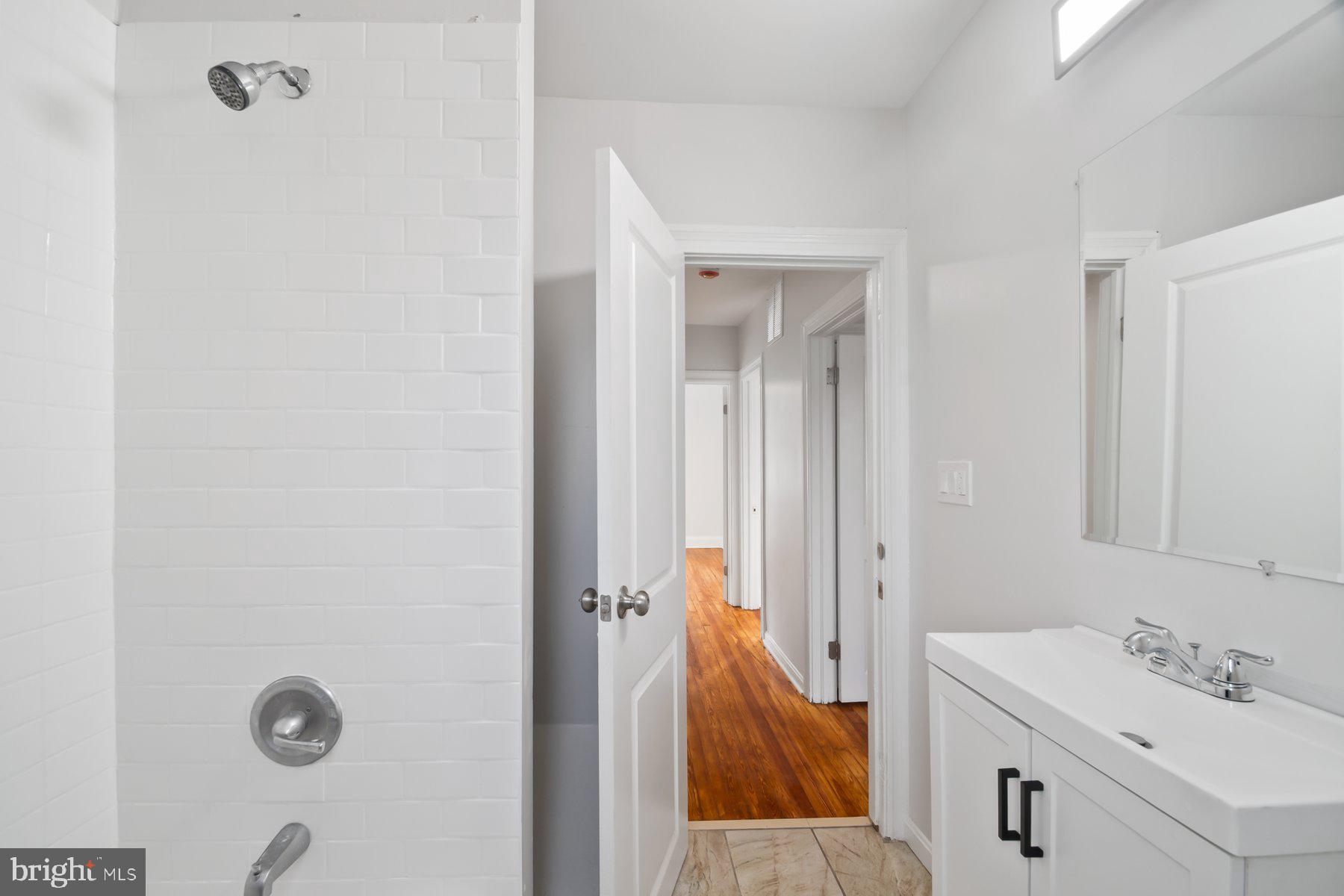 101 Willow Spring Road Dundalk, MD 21222 - Photo 19 of 28 a en suite bathroom with a sink and a mirror