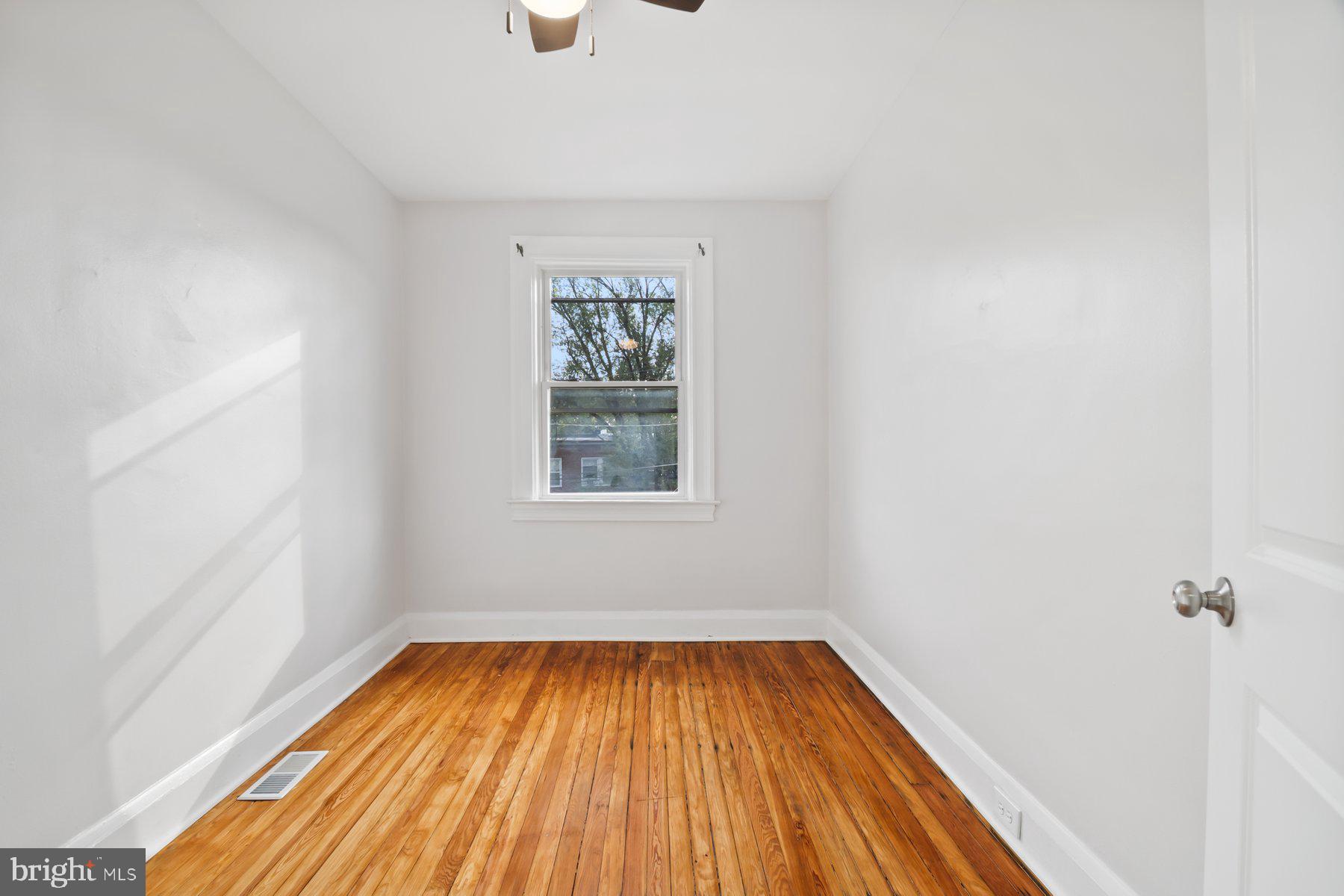 101 Willow Spring Road Dundalk, MD 21222 - Photo 20 of 28 a view of a room with wooden floor and window