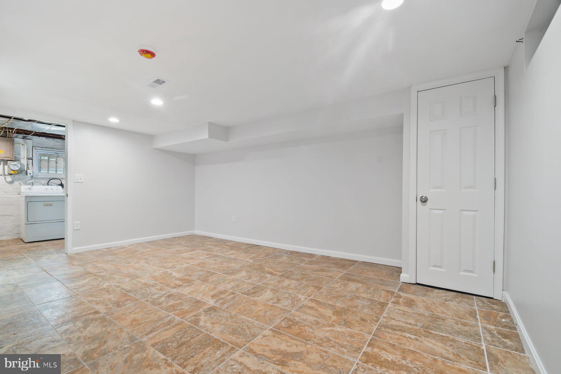 101 Willow Spring Road Dundalk, MD 21222 - Photo 22 of 28 a view of an empty room with a kitchen