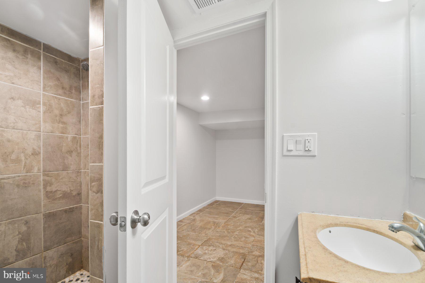 101 Willow Spring Road Dundalk, MD 21222 - Photo 23 of 28 a bathroom with a sink toilet and shower
