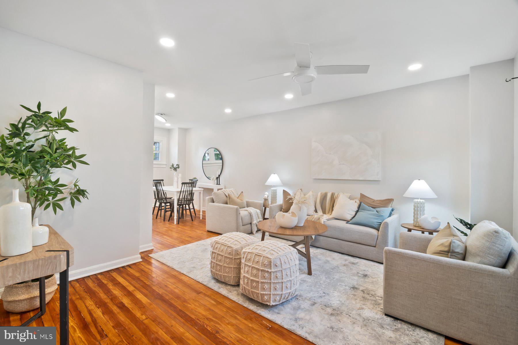 101 Willow Spring Road Dundalk, MD 21222 - Photo 3 of 28 a living room with furniture potted plant and a lamp