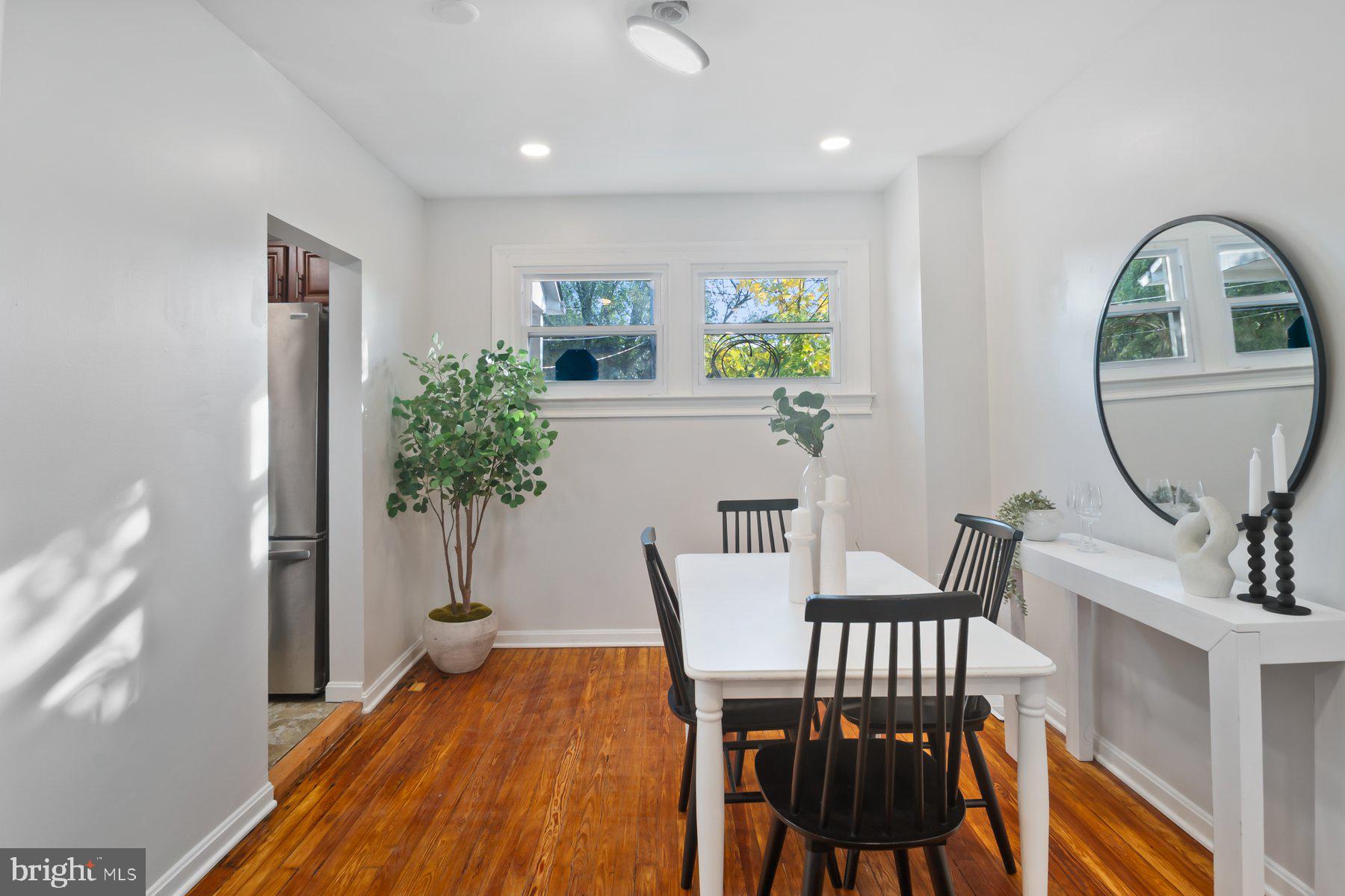 101 Willow Spring Road Dundalk, MD 21222 - Photo 7 of 28 a view of a dining room with furniture and a potted plant