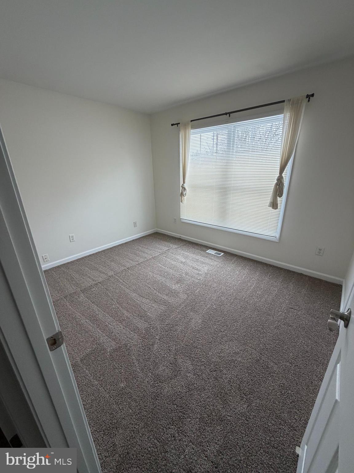 1914 Fairfax Road Annapolis, MD 21401 - Photo 7 of 10 a view of an empty room with a window