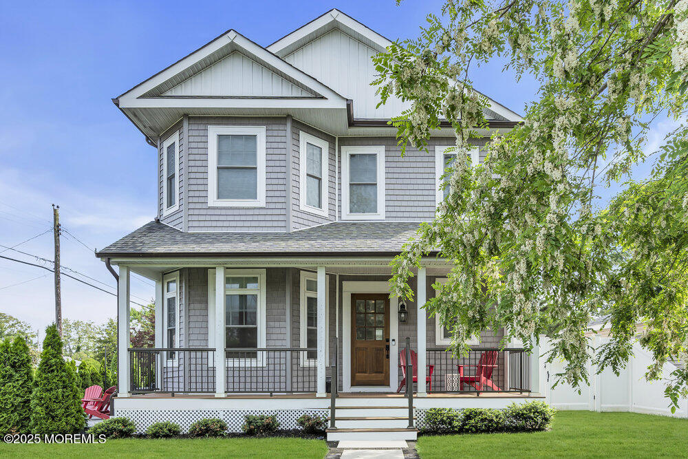 601 Ocean Road Spring Lake Heights, NJ 07762 - Photo 1 of 41 a front view of a house with garden
