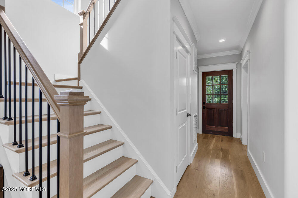 601 Ocean Road Spring Lake Heights, NJ 07762 - Photo 15 of 41 a view of a hallway with wooden floor and entryway