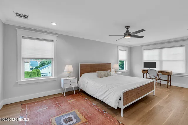 a bedroom with a bed a table and chair