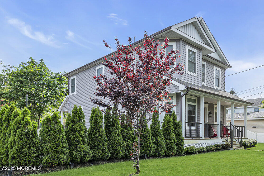 601 Ocean Road Spring Lake Heights, NJ 07762 - Photo 2 of 41 a front view of a house with a garden