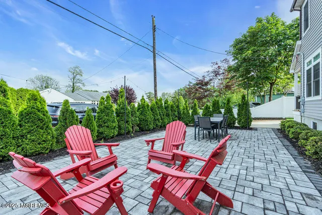 a backyard of a house with outdoor seating