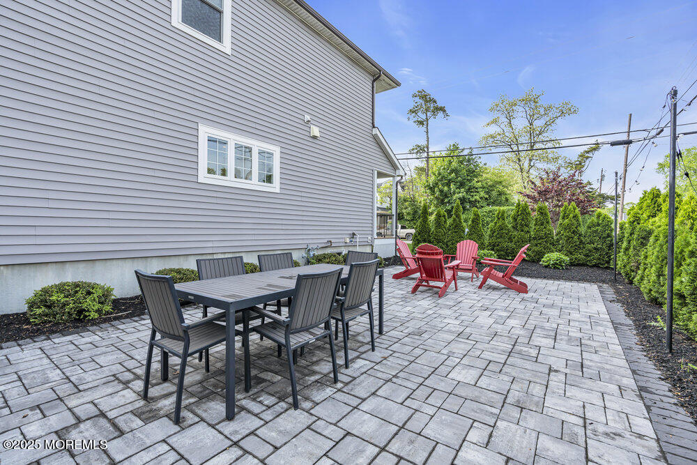 601 Ocean Road Spring Lake Heights, NJ 07762 - Photo 32 of 41 a backyard of a house with outdoor seating
