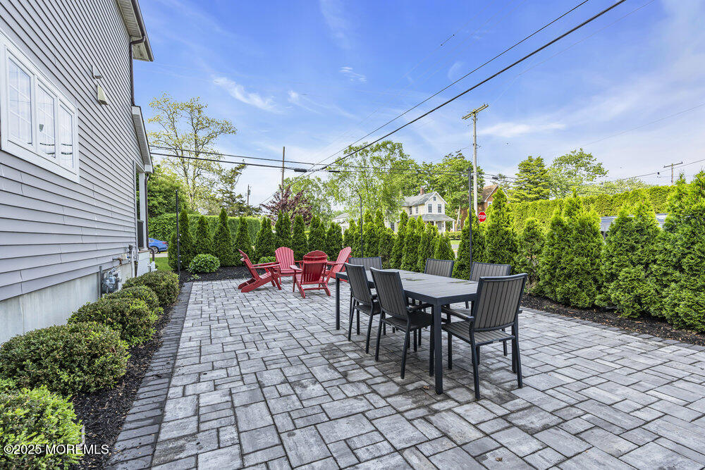 601 Ocean Road Spring Lake Heights, NJ 07762 - Photo 33 of 41 a view of a patio with table and chairs and potted plants