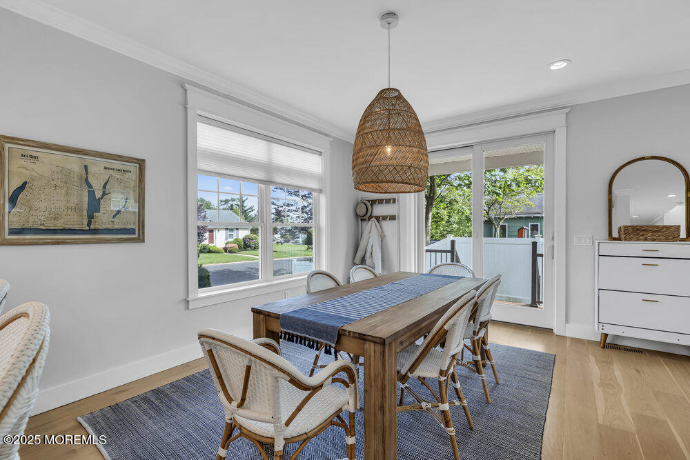 601 Ocean Road Spring Lake Heights, NJ 07762 - Photo 9 of 41 a view of a dining room with furniture window and wooden floor