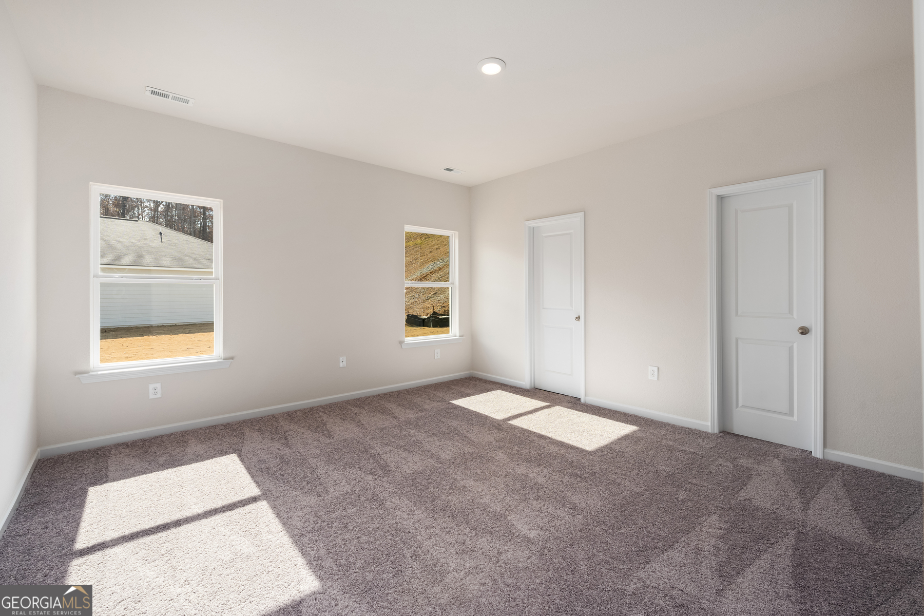 662 Mackenzie Cove Villa Rica, GA 30180 - Photo 8 of 13 an empty room with windows