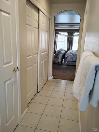 a living room with a couch and a washer dryer