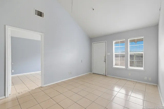 an empty room with windows