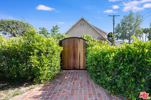 a house view with a garden space