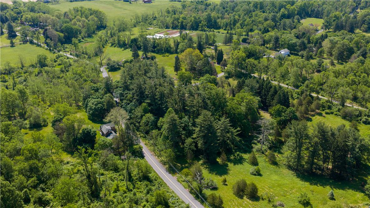 Coldsprings Rd Union Pottstown, PA 19465 - Photo 11 of 71 An aerial perspective reveals verdant landscapes and winding roads, showcasing serene rural living.