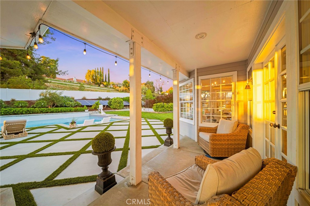 30702 Cll Pina Colada Temecula, CA 92591 - Photo 15 of 75 a living room with a large window and a table