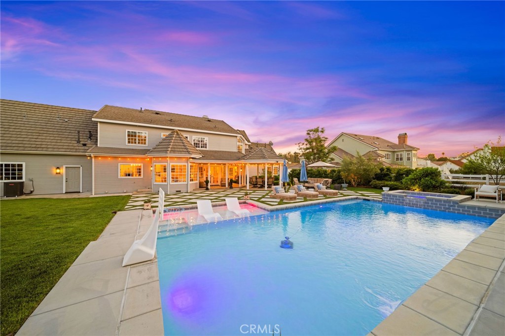 30702 Cll Pina Colada Temecula, CA 92591 - Photo 19 of 75 a view of a house with pool and a yard