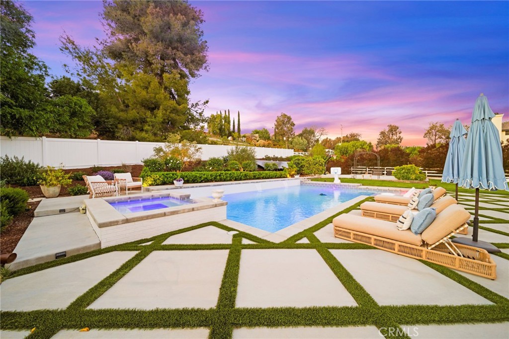 30702 Cll Pina Colada Temecula, CA 92591 - Photo 23 of 75 a view of a swimming pool with a lounge chairs