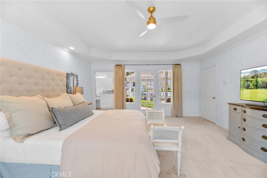 30702 Cll Pina Colada Temecula, CA 92591 - Photo 49 of 75 a spacious bedroom with a bed a dresser and a window