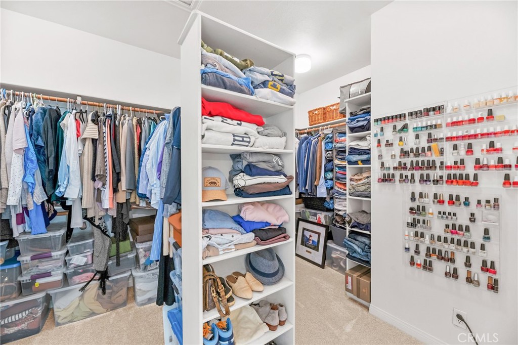 30702 Cll Pina Colada Temecula, CA 92591 - Photo 54 of 75 a view of walk in closet with clothes and shoes