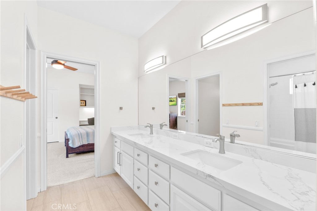 30702 Cll Pina Colada Temecula, CA 92591 - Photo 61 of 75 a spacious bathroom with double vanity and mirrors