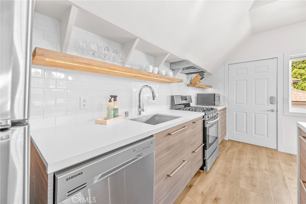 30702 Cll Pina Colada Temecula, CA 92591 - Photo 72 of 75 a kitchen with granite countertop a sink and cabinets