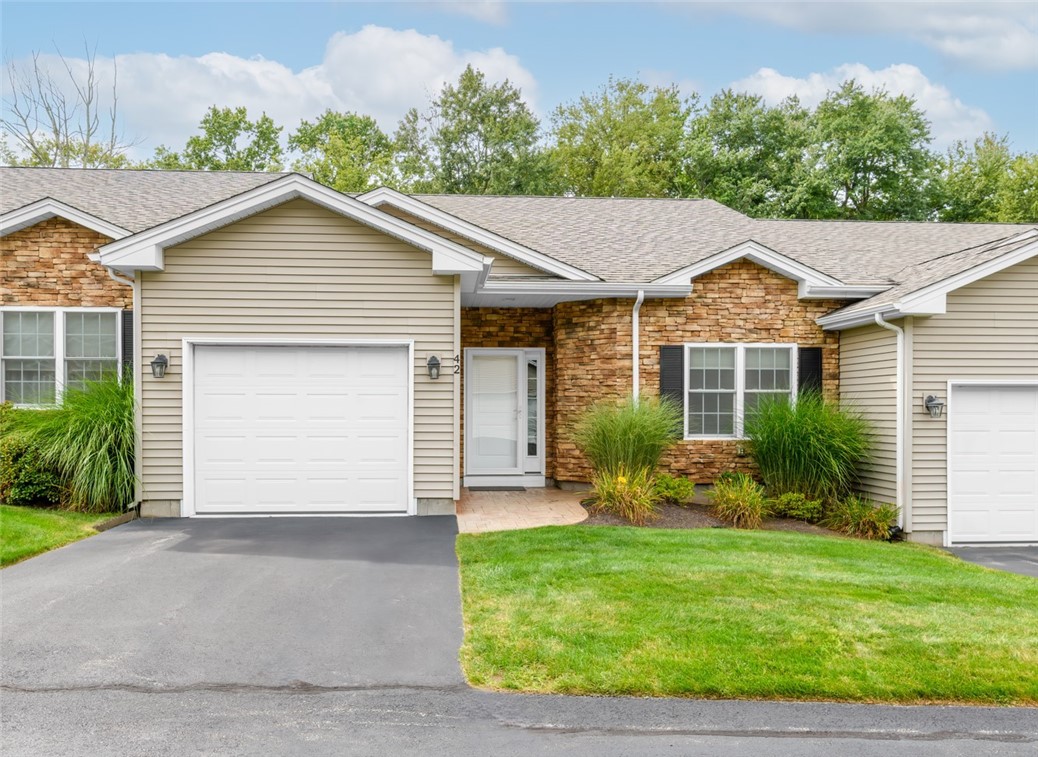 Exterior front with driveway and garage