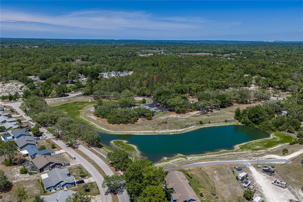 7435 Kilbride Court Weeki Wachee, FL 34613 - Photo 60 of 67 an aerial view of residential houses with outdoor space and trees