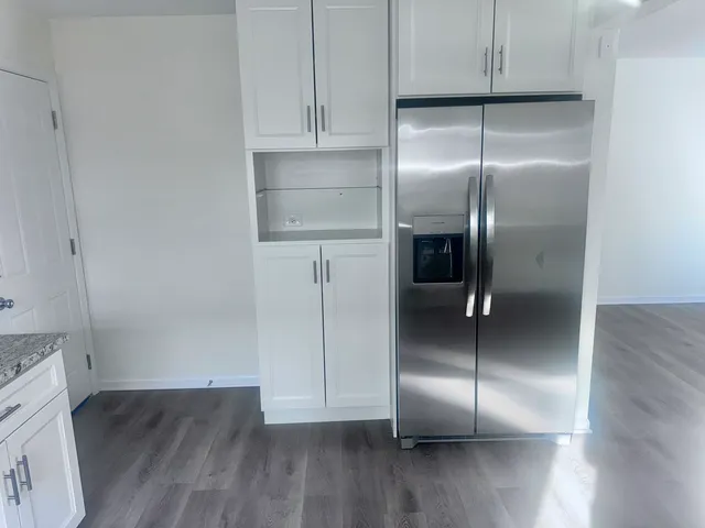 an empty room with wooden floor