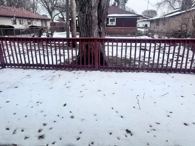 a street view that has wooden fence