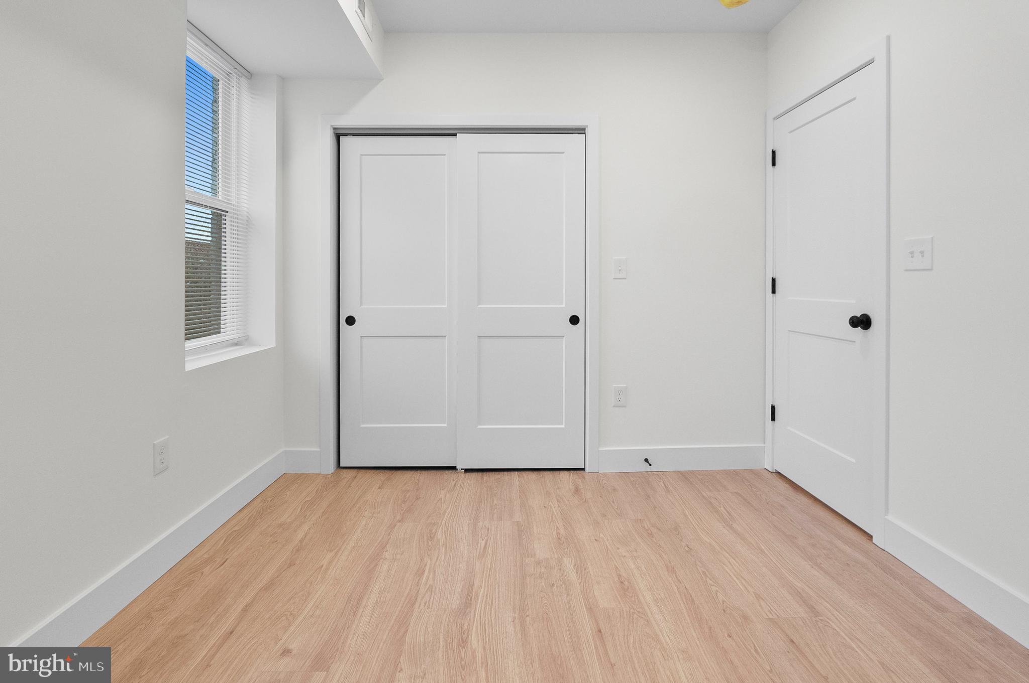 2200 East Fayette Street Baltimore, MD 21231 - Photo 18 of 23 a view of an empty room with wooden floor