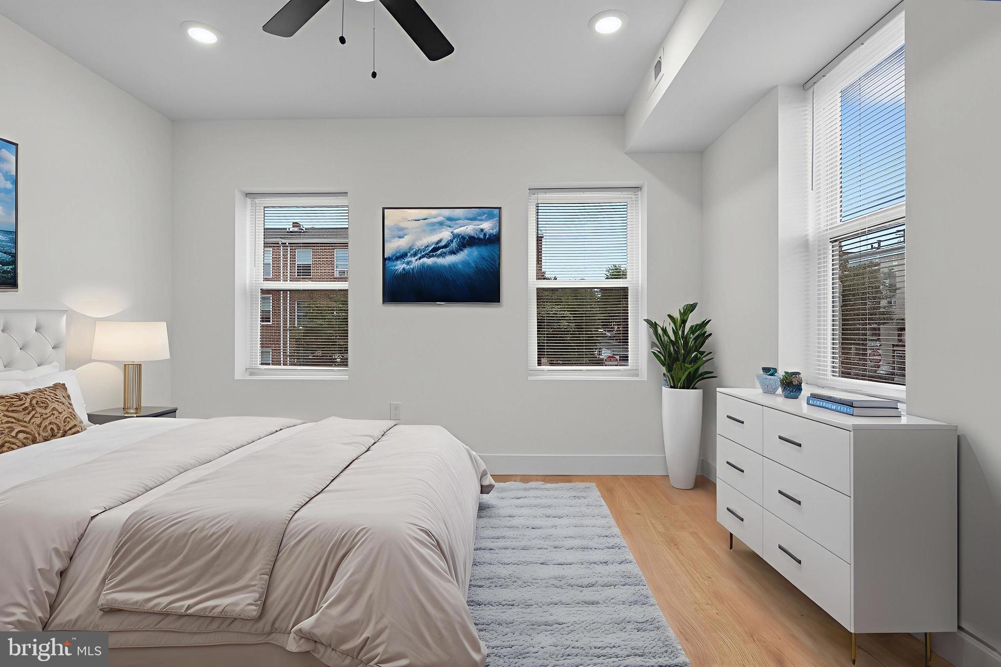 2200 East Fayette Street Baltimore, MD 21231 - Photo 9 of 23 a bedroom with a large bed and a window