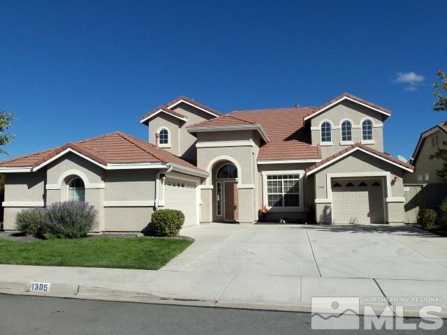 1305 Sterling Crest Lane Reno, NV 89521 - Photo 1 of 1 a front view of a house with a yard