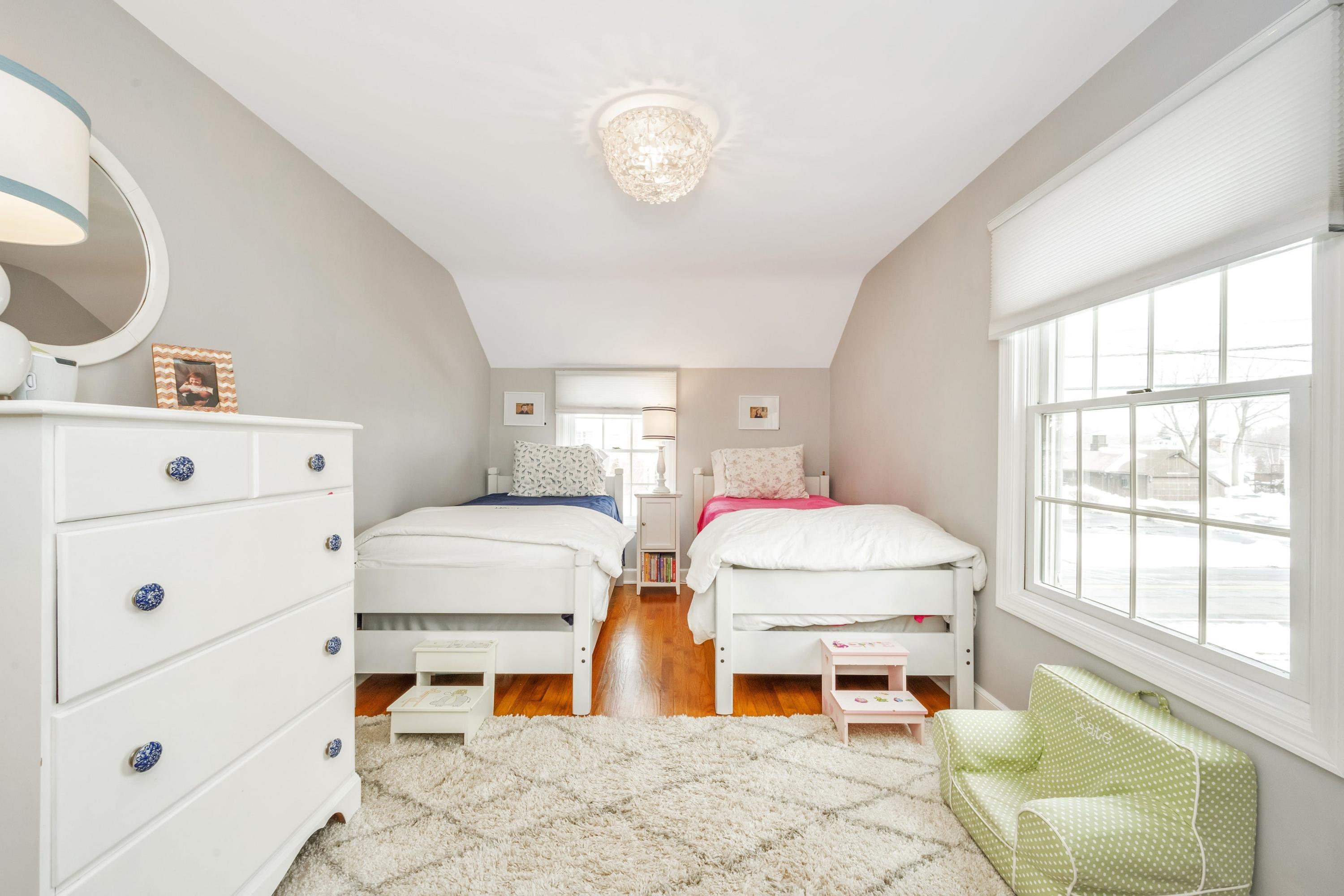 879 Oldfield Road Fairfield, CT 06824 - Photo 13 of 26 a bedroom with furniture and a window